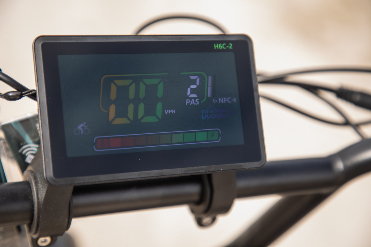 Close-up of the Talon T87’s color LCD digital display and cockpit, showing the speed and battery life while testing on a trail in the Tetons.