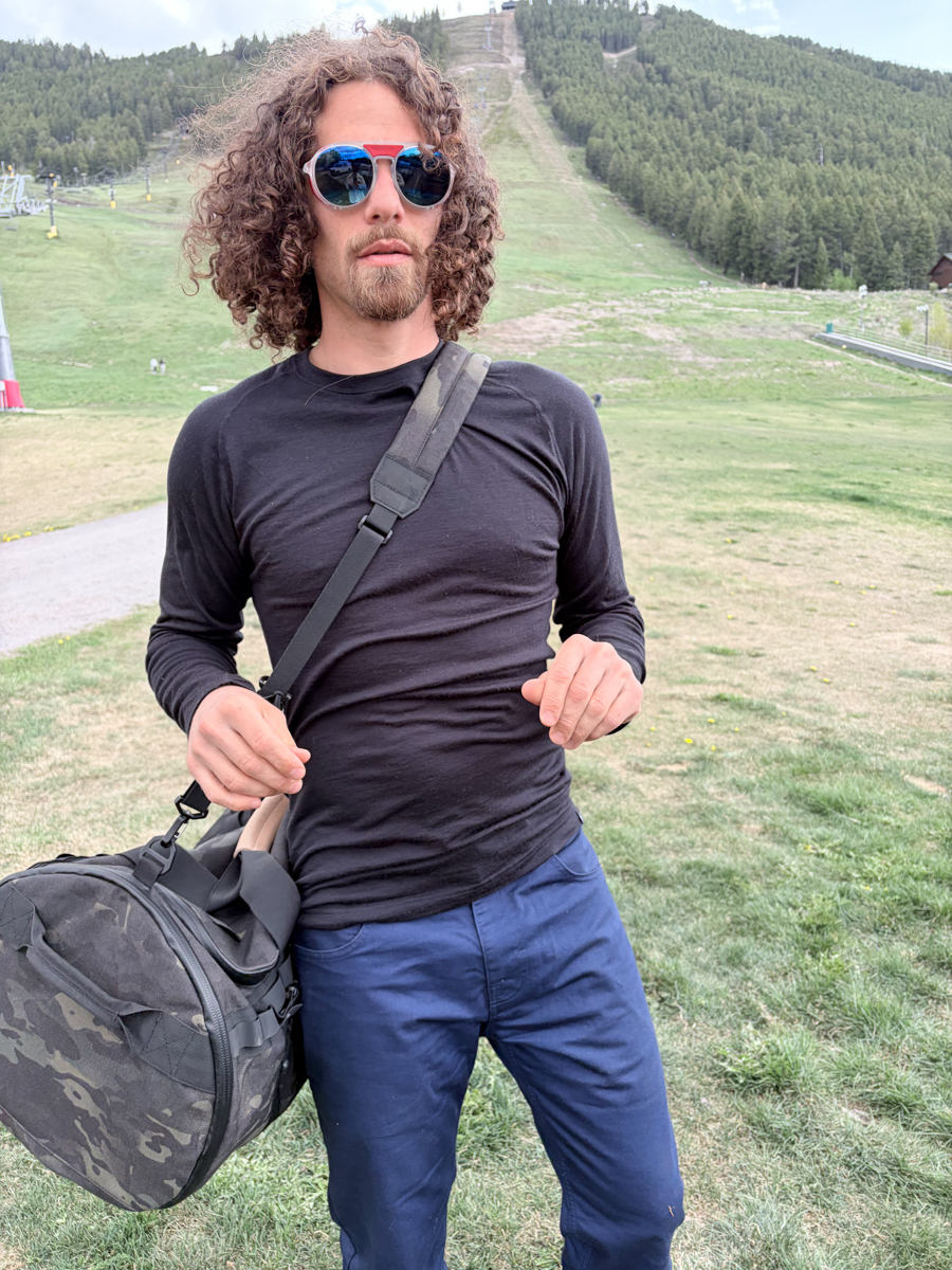 Pat Kinney TETON Testing The Buffalo Duffalo Bag at Snow King Mountain Resort base area and concert venue, with the tactical camo duffel bag featured