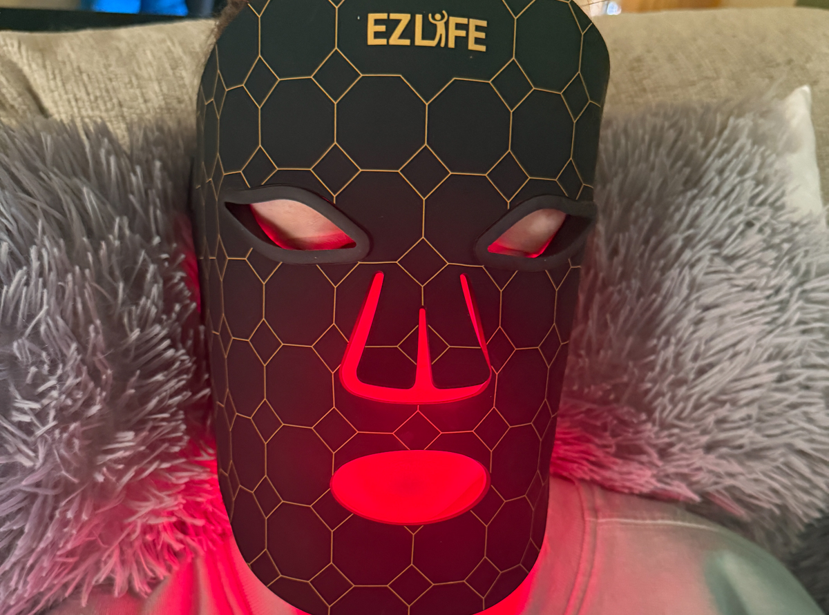 Close-up of EZ-Life LED therapy mask being worn for skin rejuvenation.