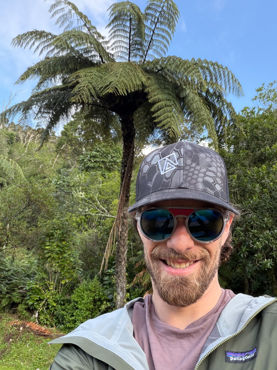 Pat Kinney wearing Vuarnet Ice Round sunglasses and Mountain Weekly News hat near Lake Okareka in Rotorua, New Zealand