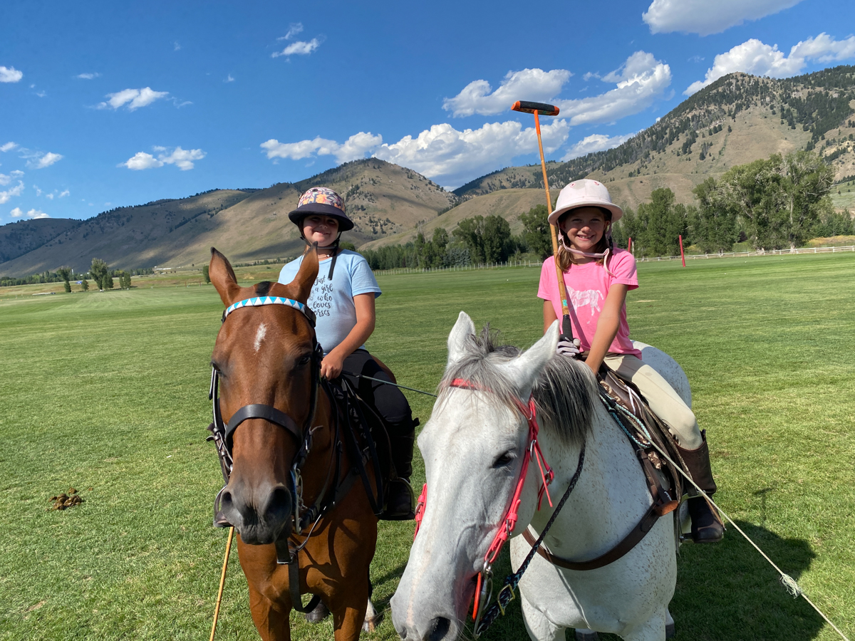 Couple of Young Girls Sitting on Polo Ponies in Jackson Hole at the local Jackson Hole Polo Club