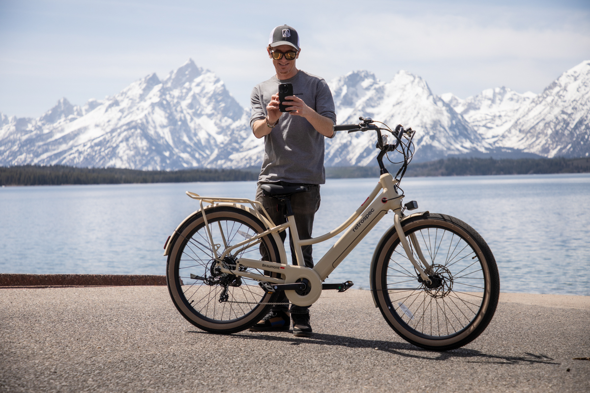 Mike Hardaker stands with the Retrospec Beaumont Rev+ beneath the Tetons. XYZ | Photo Rich Goodwin Mountain Weekly News