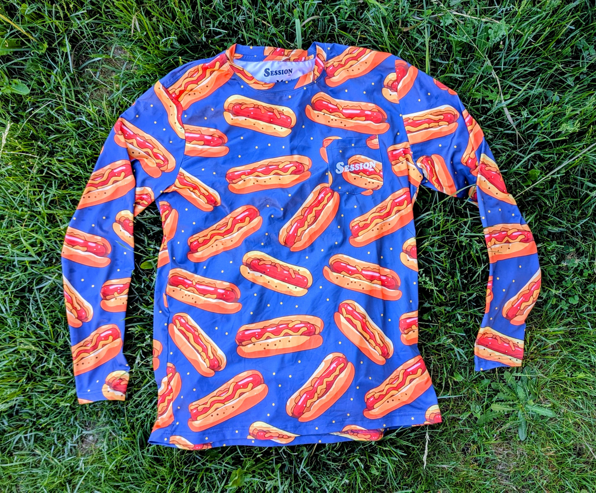 T-shirt with orange hot dogs and blue backgroujnd from sessions co