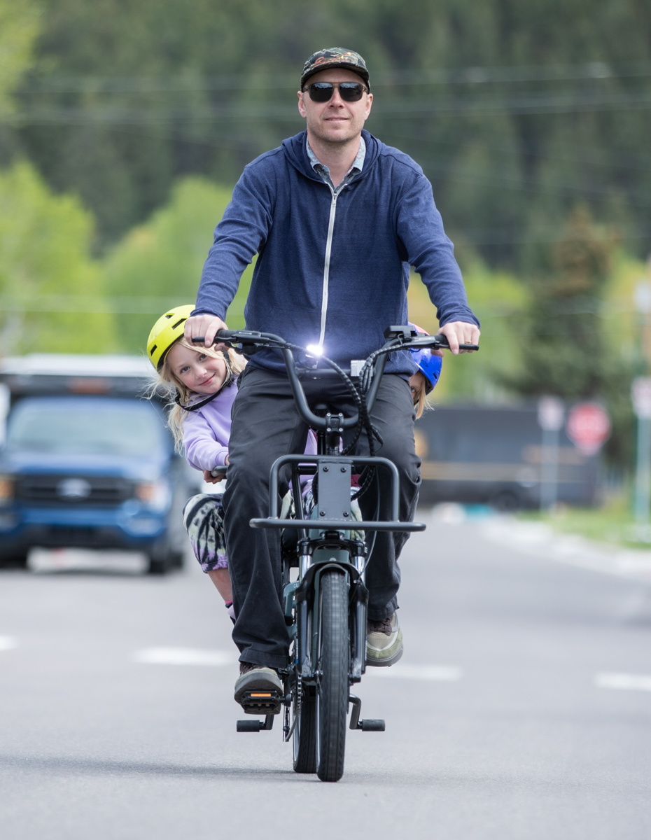 Eric Odlin rides the Xtracycle Hopper E-Bike straight toward the camera on a street in the town of Jackson, WY.