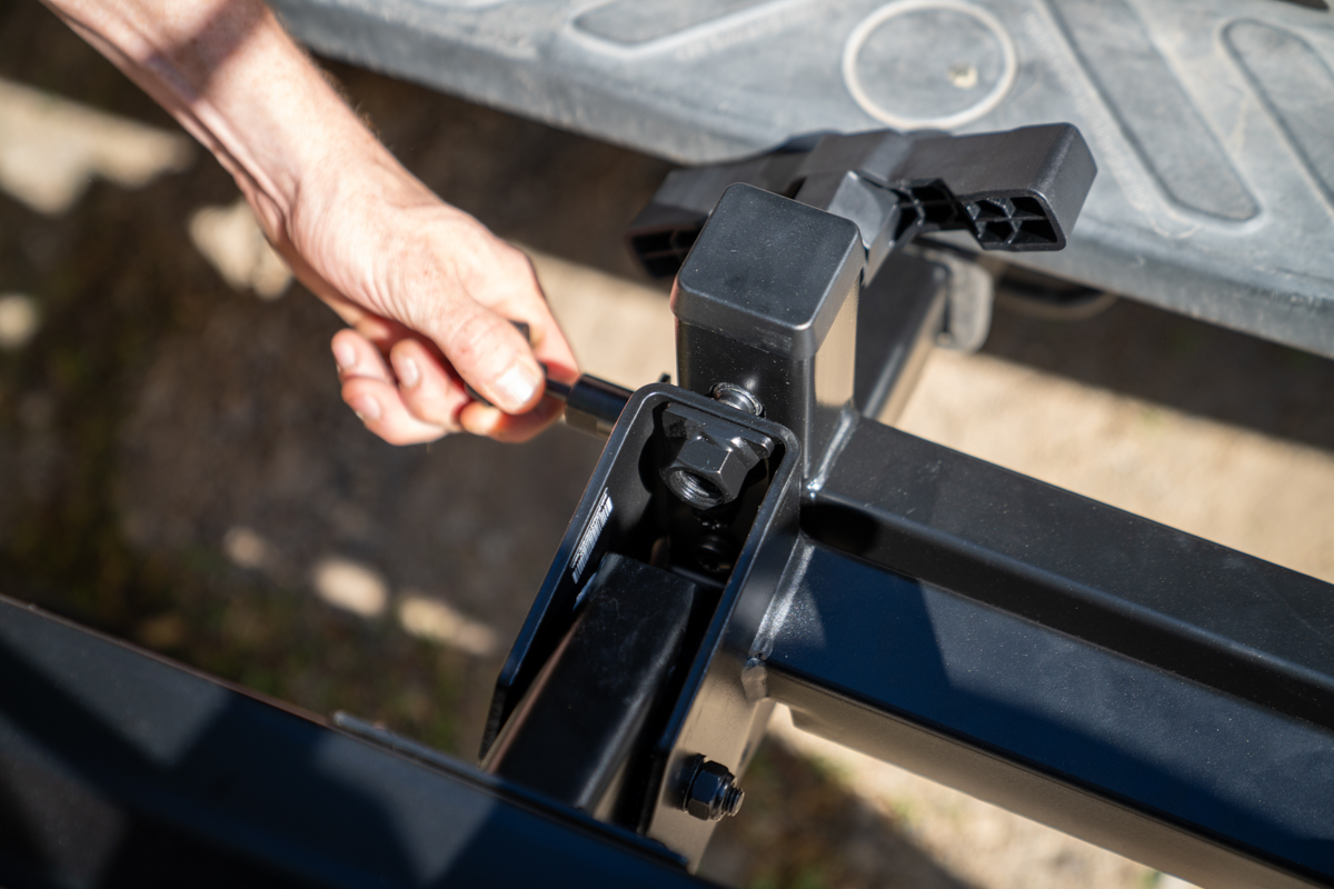 Close-up of Yakima StepUp Swing hitch locking mechanism and bolt adjustment