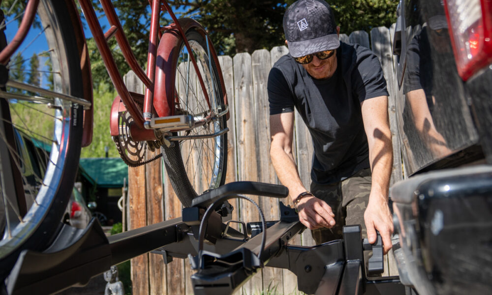 Mike Hardaker standing beside the Yakima StepUp Swing 2 inch bike rack in Jackson Wyoming