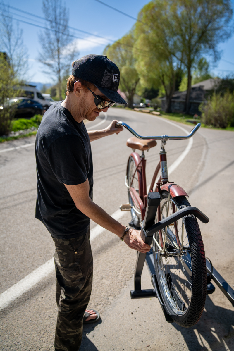 Mike Hardaker tightening frame clamp on Yakima StepUp Swing 2 inch rack