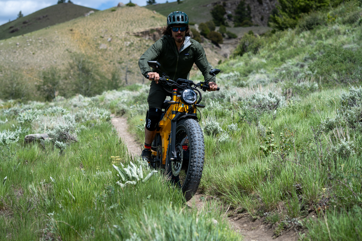 Pat Kinney riding the Aniioki A9 Pro Max through sagebrush terrain near Jackson Hole while testing the dual motor performance.