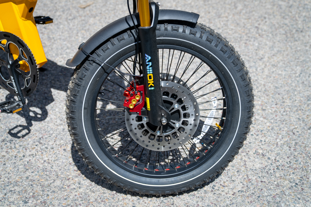 Close-up of the Aniioki A9 Pro Max front wheel, oversized brake rotor and dual braking system during testing in Jackson Hole.
