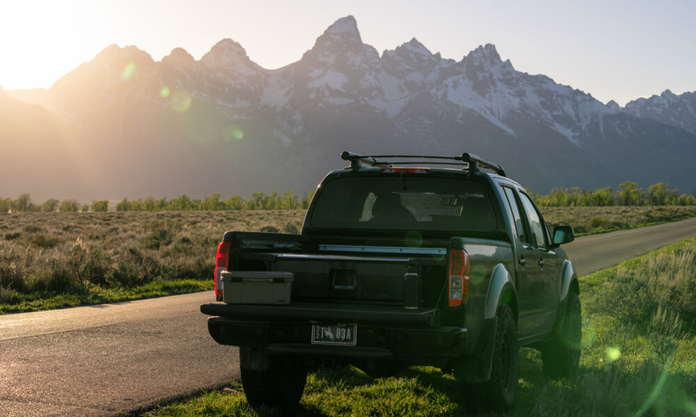 Nissan truck equipped with DECKED Drawer System parked beneath the Teton Range in Jackson Hole Wyoming