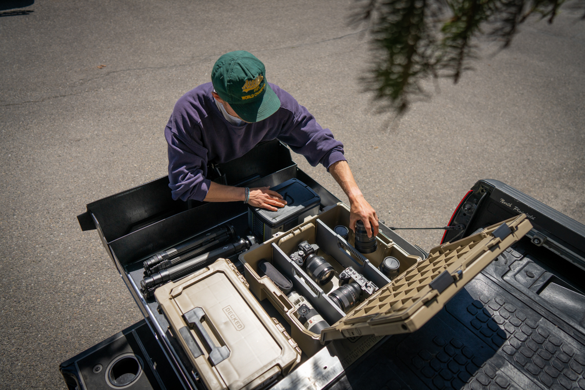 Photography equipment organized inside DECKED drawer system used as mobile camera workstation