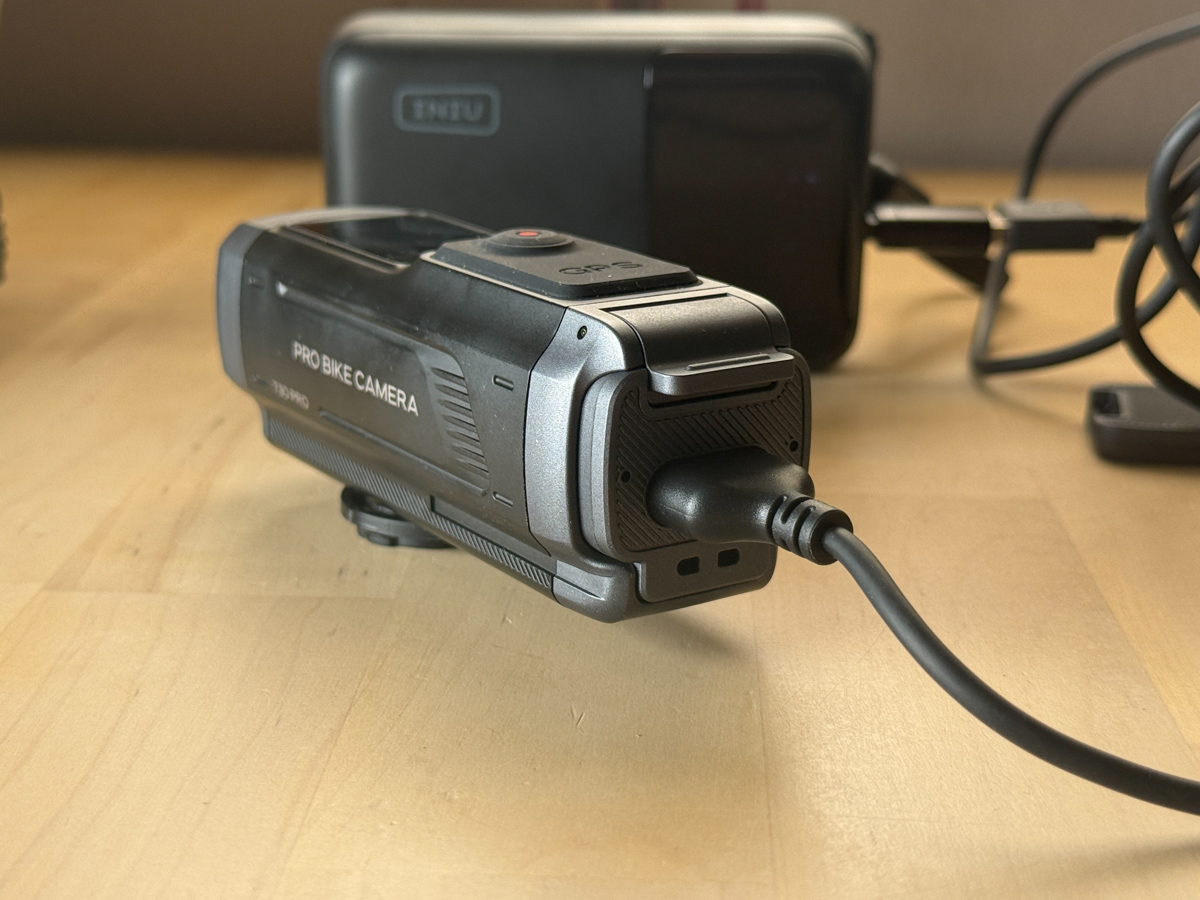 INIU Cougar P63 25,000mAh 100W USB-C power bank connected to electronic devices during testing.