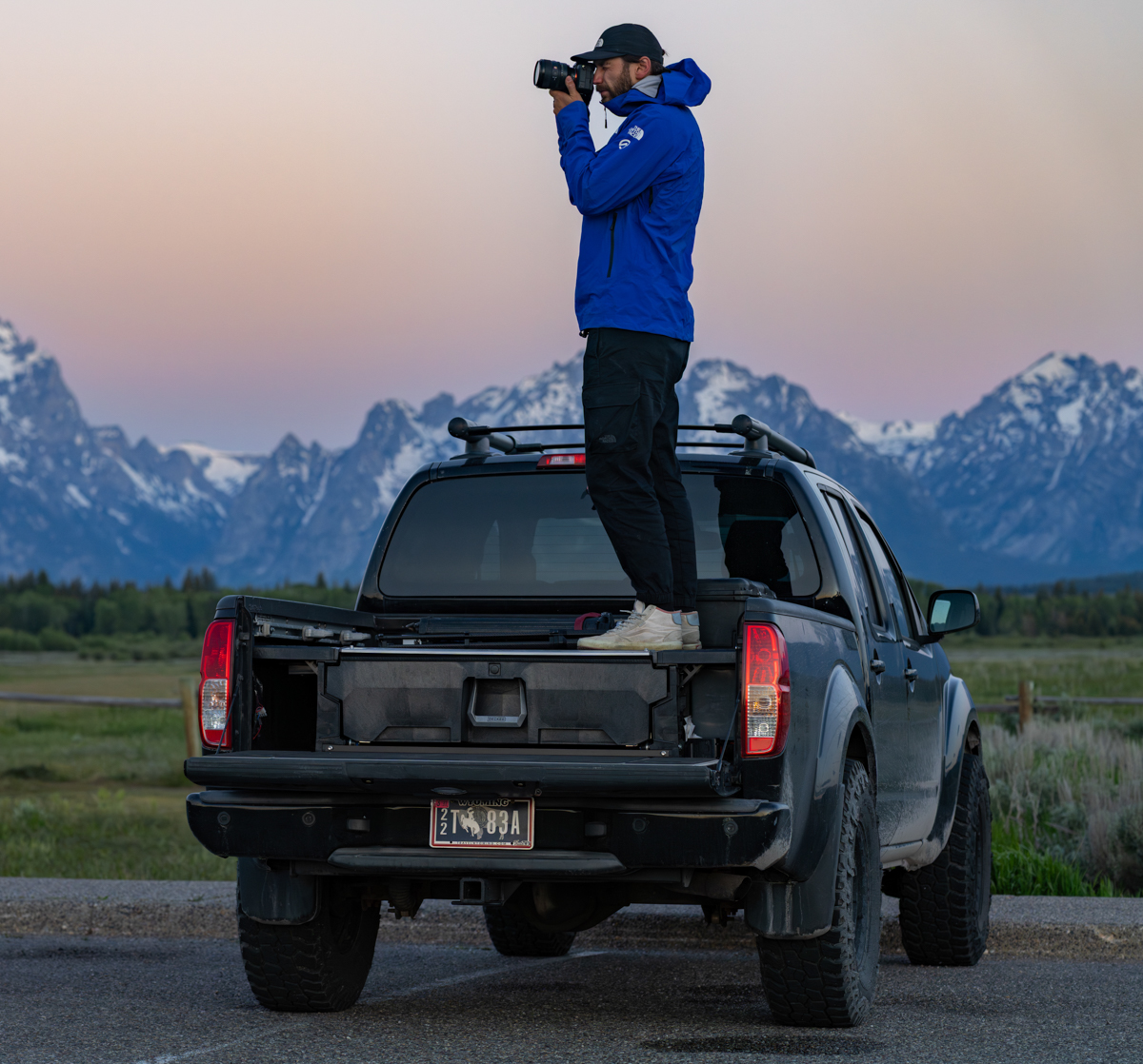 Jackson Hole Photographer from TGR and NAT GEO Griffin Kerwin Mountain Weekly News Standing Atop a Truck Bed Getting the DECKED System TETON Tested