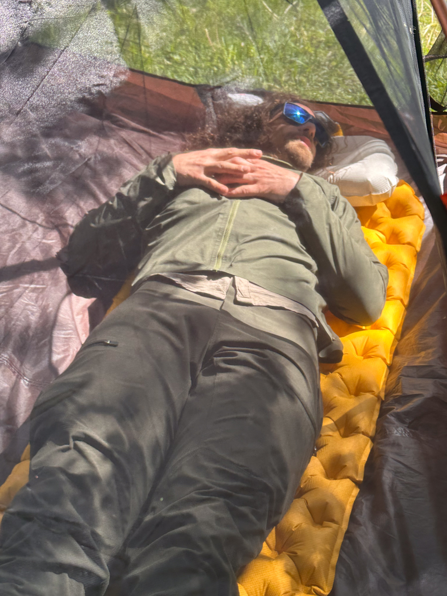 Pat Kinney testing the Sea to Summit Ultralight XR Sleeping Pad and Aeros Pillow inside a tent during a backcountry camping gear test