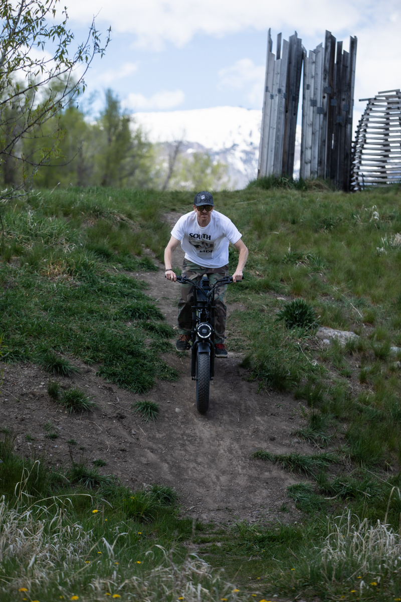 Mike Hardaker riding the Talon T757 fat tire e-bike downhill on a dirt trail during TETON Tested review