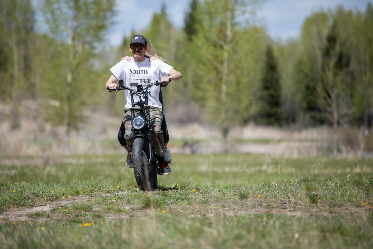 Mike Hardaker riding the Talon T757 electric bike with a passenger during testing in Jackson Hole Wyoming