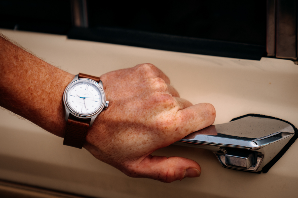 Mike Hardaker wearing the VERO x Wildwood Studio Edition while driving the Grizzly Woody through Jackson Hole. The versatile automatic watch transitions seamlessly from mountain town adventures to formal occasions. | Photo Griffin Kerwin Mountain Weekly News