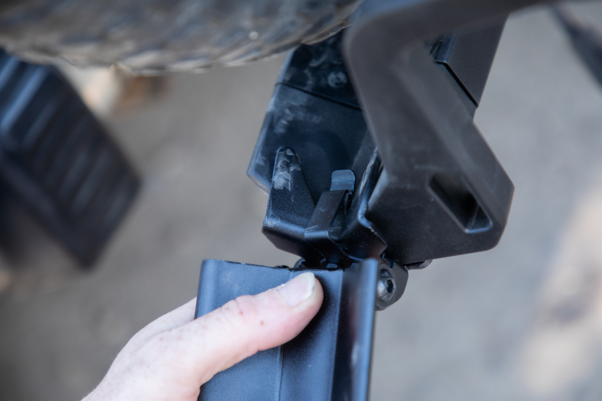 Man loading heavy e-bike up a Saris E-Bike Ramp