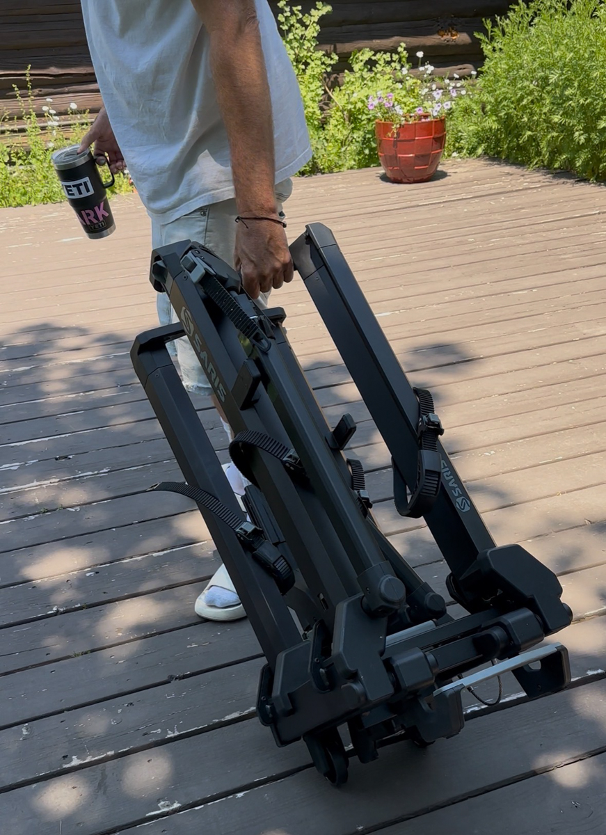 Man moving e-bike rack with wheel